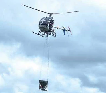 Hughes 300 helicopter doing sling training